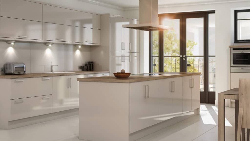 A modern cream coloured kitchen with high gloss kitchen cabinets